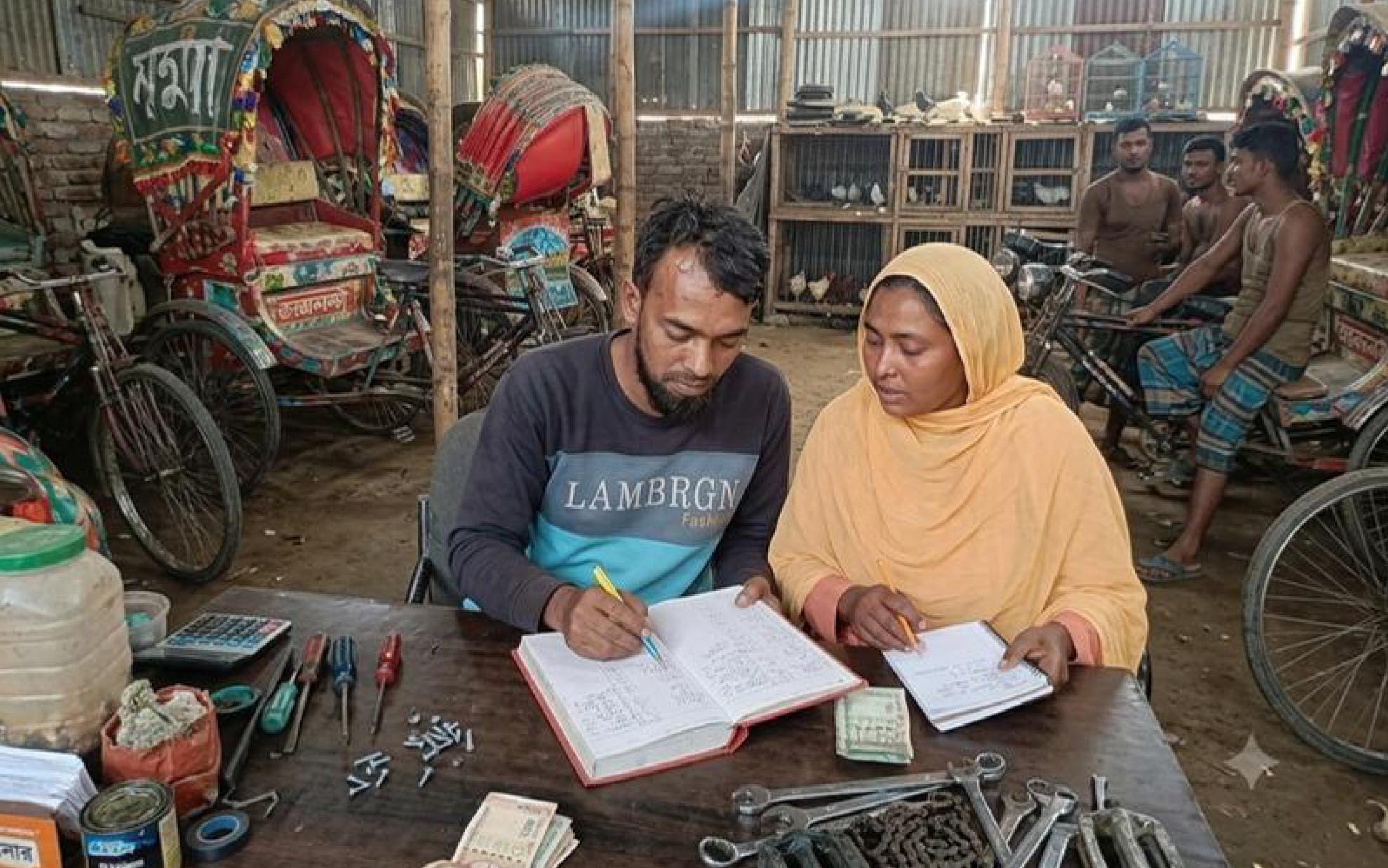 Shahana and her husband looking after the accounts